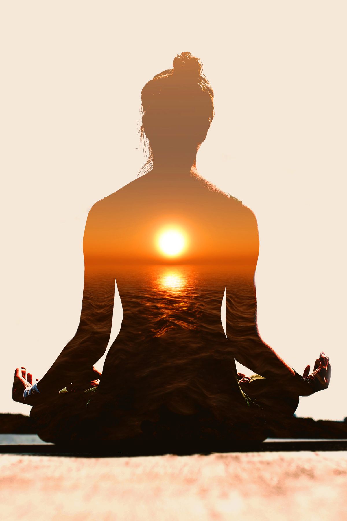 Silhouette of a woman in lotus position and the sunset.