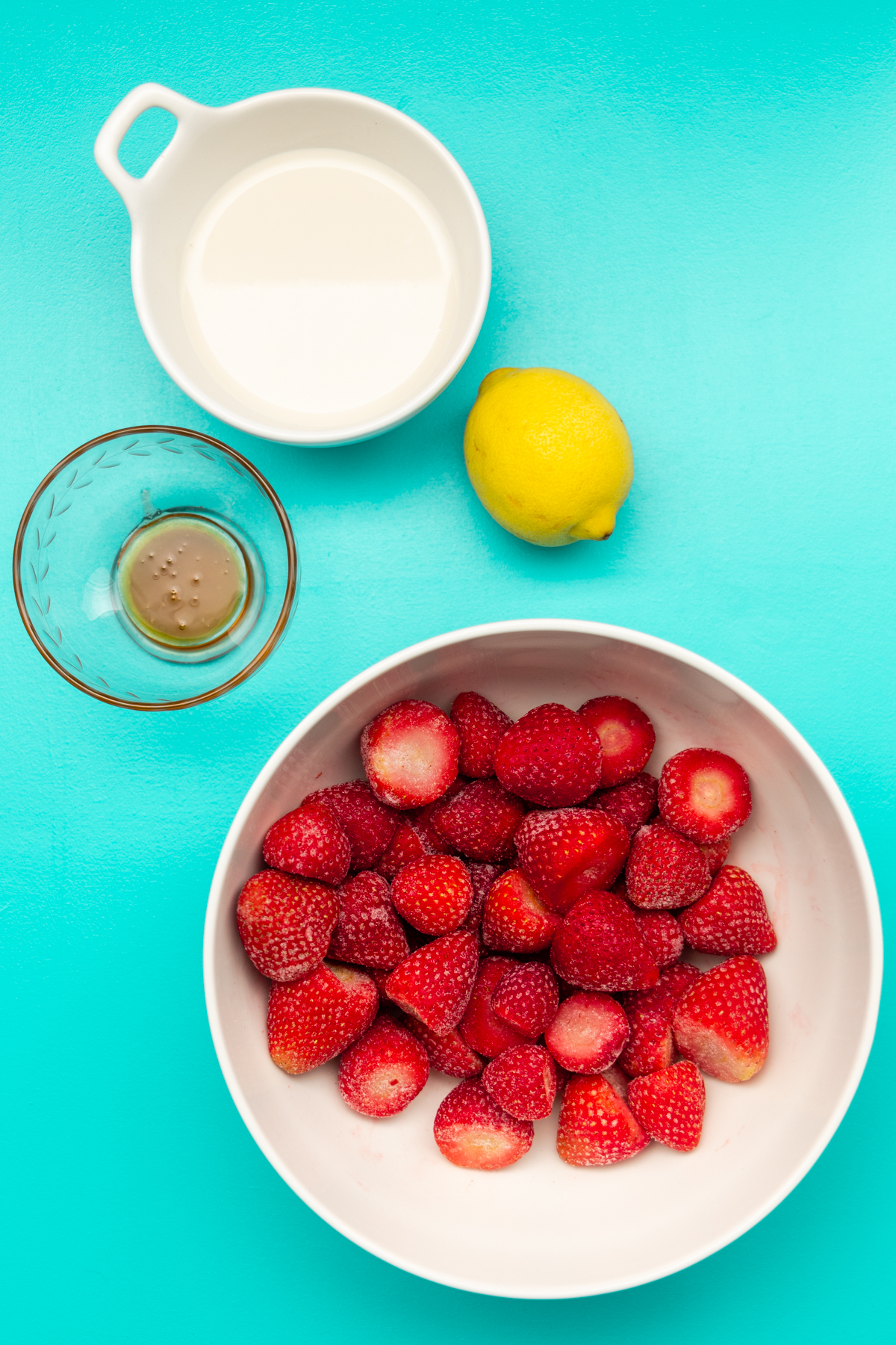 Ingredients for strawberry smoothie bowl recipe.