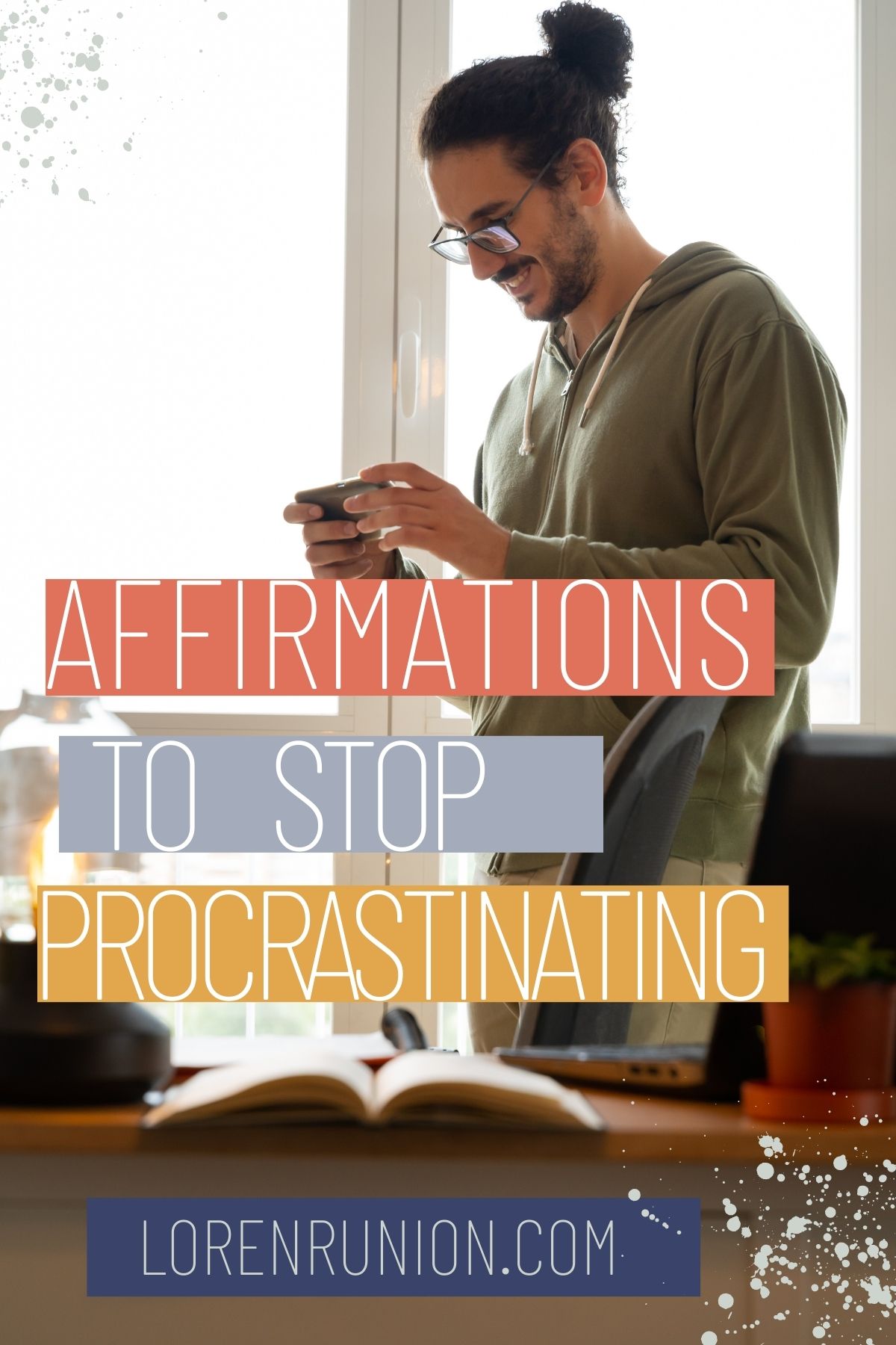 A man in a green shirt playing on his phone.