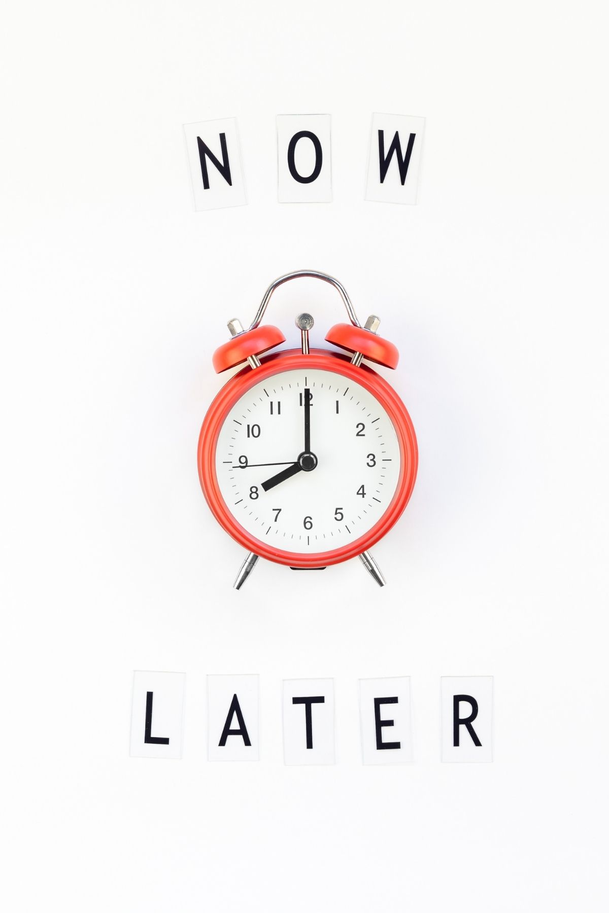 A white background with an orange alarm clock.