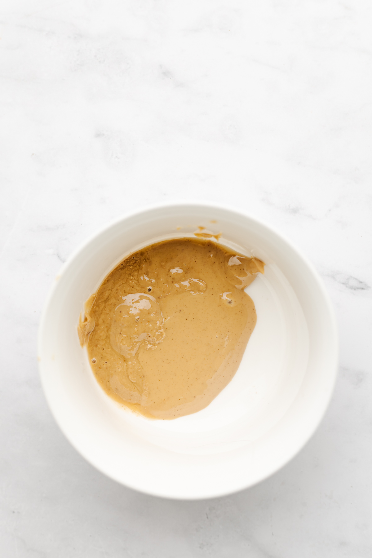 Peanut butter drizzle in bowl.